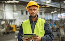 person holding tablet in warehouse, ERP Trends, 